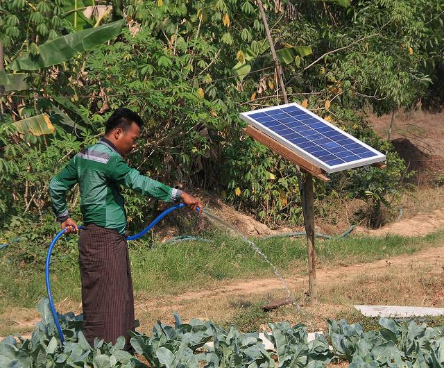 A farmer in Myanmar with the solar-powered Lotus pump.  Credit: Ashden
